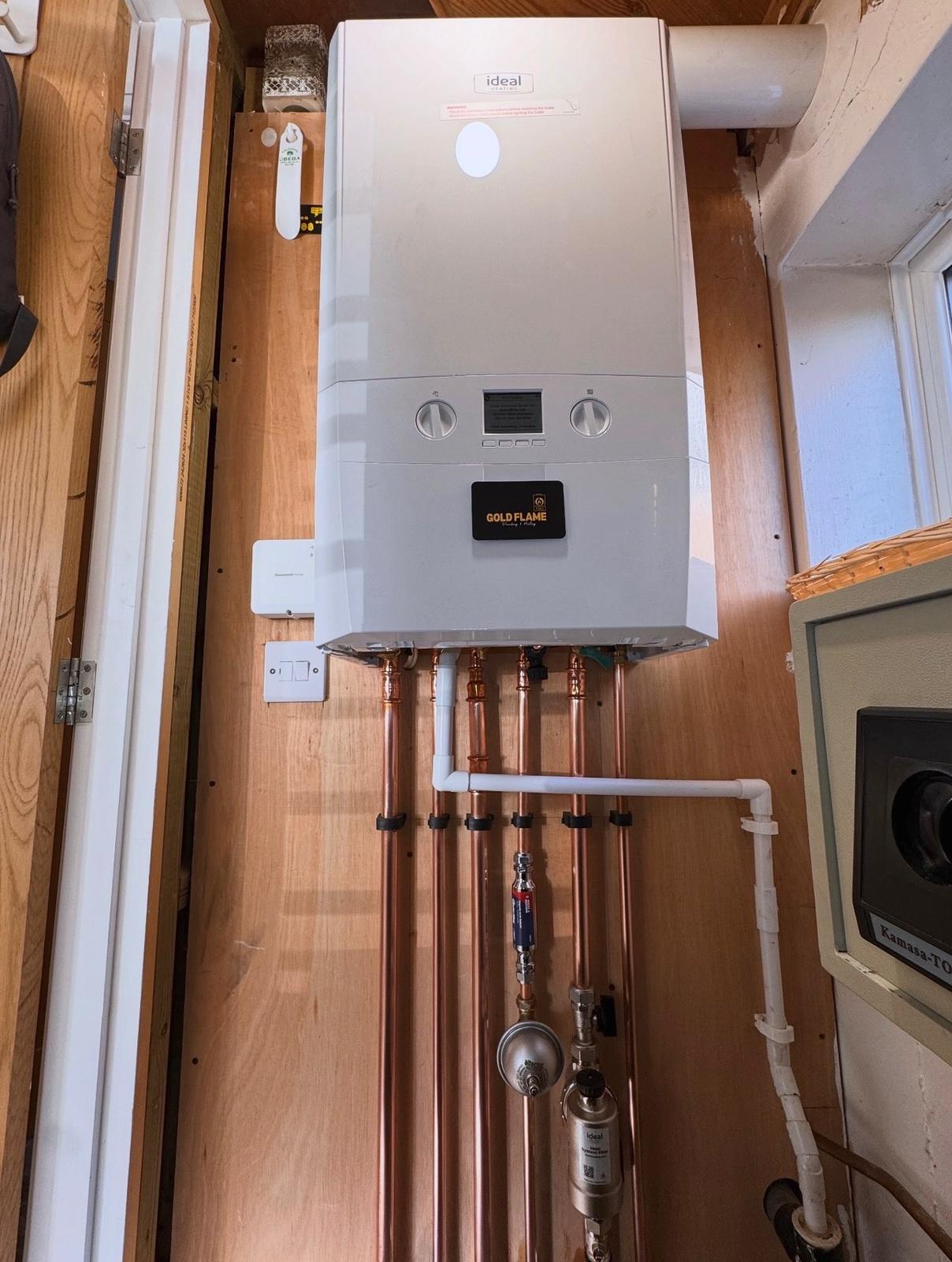 Ideal boiler installation with Goldflame branding.