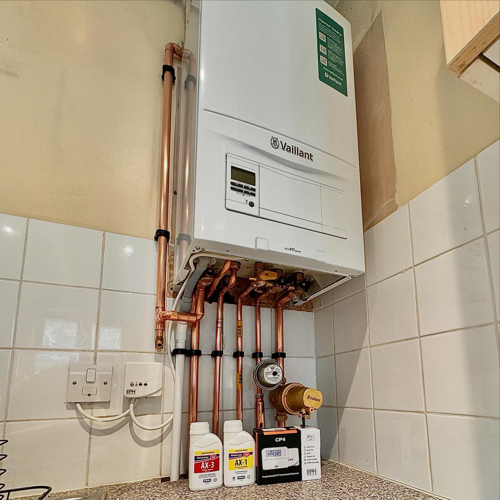 Vaillant boiler installation in a tiled kitchen.